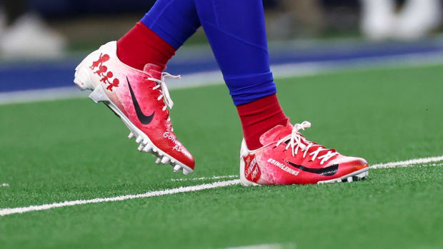 View of red and white cleats.